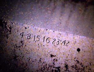 The Lost Numbers (4, 8, 15, 16, 23, 42) printed on the entrance to The Hatch (image from lostpedia.wikia.com)