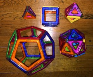 A set of five platonic solids, made using magnetic clear coloured plastic pieces
