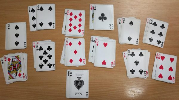 A deck of cards arranged in 13 piles of 4 cards