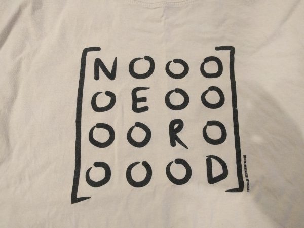 Photo of a t-shirt with a drawing: 4 by 4 matrix with N E R D along the diagonal