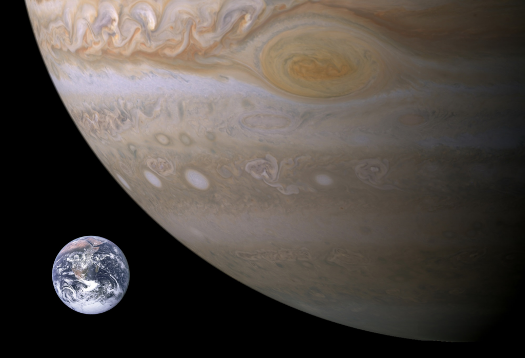 A view of Jupiter, with much smaller Earth next to it