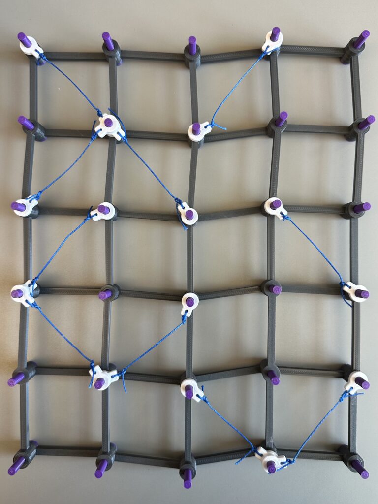 A square grid with bracing wires.